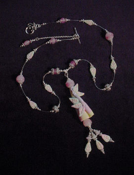 Handcrafted Polymer Clay Pastel Pendant Necklace- Handcrafted with polymer clay. All findings, crimps, beads, bali beads and clasp are in sterling silver. Lampwork glass beads, Beadalon .018 inches silver wire are used for final details. Unique design! 