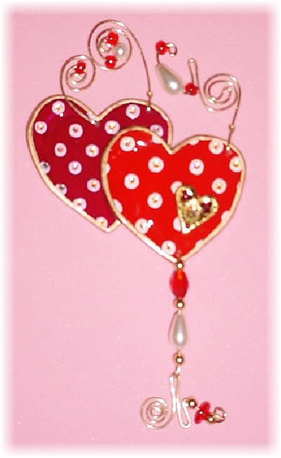 Valentine's Polka-Dots Hearts Pin: Dimensions: About 4.5 in x 2.5 in(including the beaded wires)Description: This porcelain handmade ornament is painted in bright colors and gold enamel details. Embellished w/AB and Ruby Austrian Crystals. Glass beads and pearls are used. Also, gold color wire is used for final details.Express your feelings with this unique gift! Retail Price: $25.50
