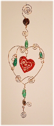 Seasonal Wire Heart Ornament- Dimensions: About 10.75 in x 8 in. Description: This handmade ornament is hand crafted in Copper with blown glass beads. Each detail is created based on the artist's perspective and creative freedom of expression. Beautiful for garden, terrace or home accent decor.Unique Design! Retail Price: $28.00