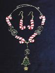 Candy Canes Necklace & Earrings Set-This porcelain handmade necklace is painted in glossy red and white for the candy cones and green and gold enamel details for the Christmas tree.  Also some foil effects are applied. Austrian Crystals, glass  beads and gold plated wire is used for final details. Earrings, are one set of two Candy Cones design