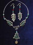 Christmas Leaves Necklace & Earrings Set- This porcelain handmade necklace is painted in glossy  green and gold enamel details.  Also,  some foil effects are applied. Austrian Crystals, glass beads and gold plated beads are used for final touches. Gold plated wire is used for final details. Earrings, are one set of two Leaves design.