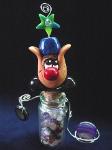Good Luck Aladdin Snail- Handmade with Fimo. Glass bottle full of polished Quartz pieces. Two polished rocks are resting in silver wire. Austrian crystal is used for final details. 