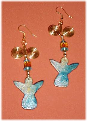 This porcelain handmade earrings set is painted in bright blue, gold and translucent colors. Glass  beads and gold plated wire and findings are used for final details. Very Unique!