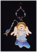 Christmas Fishing Angel Ornament- This porcelain handmade ornament is painted in translucent colors, antique gold paint and gold enamel details. AB Austrian Crystals, glass  beads and wire are used for final and hanging details. Oops! I got Jesus in the fish!