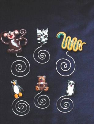  Handmade of glazed Fimo. Nickel wire is used for final details. You can use them as bookmarks or paper clips. Different, fun and functional! Unique designs for any taste! More designs will be available soon!