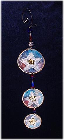 This porcelain handmade ornament is painted in glossy patriotic colors. Glass beads and wire are used for final details. Also, some foil effects are applied. Different and Unique!!!