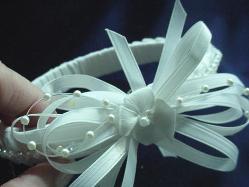 Handmade with satin ribbon, pearls and beads. Ribbon handmade roses are also applied for final details. Beautiful and unique designs to match any baby set.