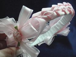 Handmade with satin ribbon, pearls and beads. Ribbon handmade roses are also applied for final details. Beautiful and unique designs to match any baby set.