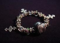 Black Widow Marbleized Bracelet -Handmade polymer clay beads, unique glass beads, charms, pewter and silver plated beads and findings. Each bracelet comes with a satin bag (pouch). Nice for a gift! 