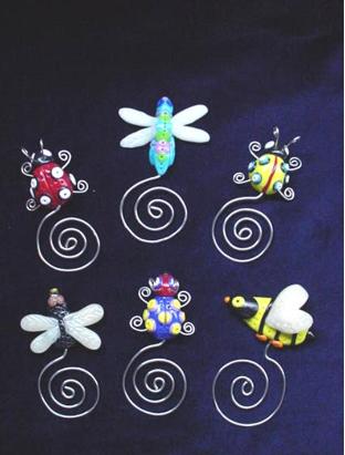 Handmade of glazed Fimo. Nickel wire is used for final details. You can use them as bookmarks or paper clips. Different, fun and functional! Unique designs for any taste! More designs will be available soon!