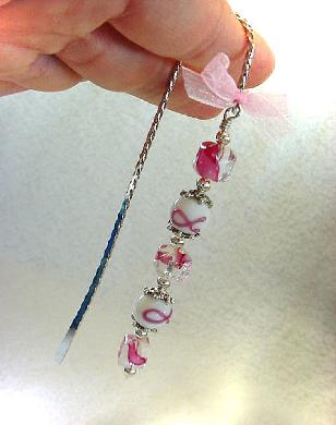  Cancer Awareness Bookmark - Handcrafted with a twisted metal bookmark, glass and silver beads and spacers. Pink organza ribbon. Because we have hope! Each bookmark comes in a suede black bag for protection and presentation. Just beautiful and tender!