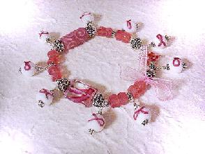 Cancer Awareness Bracelet-Because we want your customers to have this bracelet, the earrings or the bookmark, let's celebrate HOPE,COURAGE,STRENGTH and LOVE... The PRODUCTION TIME during the month of September for the Cancer Awareness items will be ONE WEEK or less!!! Bracelet is: Handcrafted with glass beads and bali sterling silver. Stretch cord for size flexibility. Pink organza ribbon. SS bali beads may vary in design, depending on availability. Just Exquisite! 