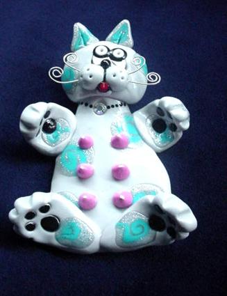 Handmade with glazed Fimo. Silver plated  wire is used for final details. Pins are embellished with Austrian crystals.