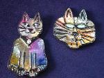 Cat Pins Set (2)-  These porcelain handmade pins are hand-painted in bright colors and black enamel details. Accented Austrian crystals for the eyes. Very different! Great for the cat lovers