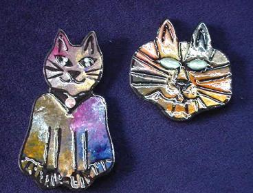  These porcelain handmade pins are hand-painted in bright colors and black enamel details. Accented Austrian crystals for the eyes. Very different! Great for the cat lovers