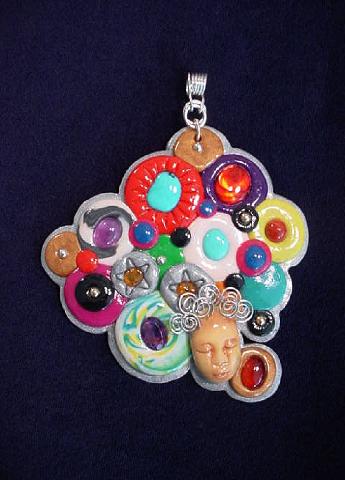Gems and Polymer Faces- Handmade with Polymer clay. Hand-crafted SS pendant holder. Embellished with cabochons of different gems and faceted amethysts. Pendant includes a SS chain. Boxed. Very different and colorful.
