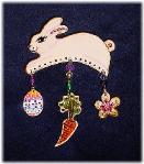 Easter Bunny Pin- This porcelain handmade pin is hand-painted in translucent paints, bright pastel colors and gold enamel details. Accented w/Medium and 5mm Amethyst, Emerald, AB and Topaz Austrian Crystals. Gold plated wire and glass beads are used for final details. Unique Design!