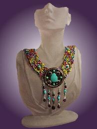 Fiber Crochet Turquoise Necklace - A special order from Cleopatra, and also Nefertiti wants it too! Handcrafted crochet with fibers. Metal Silver medallion. Chinese, Kingman, Sleeping Beauty Turquoise and A Grade Amethyst. Sterling Silver findings and clasp. Limited production.