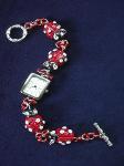 Fimo Red Lady Bug Watch-  Handmade with glazed Fimo. Silver plated  wire, findings and clasps are used for final details. Antique Silver watch embellishes this Fimo Lady Bug creation.
