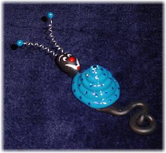 Handmade with glazed Fimo. Nickel and silver wire are used for final details. Pins are embellished with Austrian crystals.