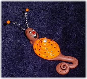 Handmade with glazed Fimo. Nickel and silver wire are used for final details. Pins are embellished with Austrian crystals.