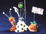 Halloween Snail Photo or Note Holder, handmade crafts-Handmade with glazed Fimo. Nickel and silver wire are used for final details. Each Item can be personalized or the note can bring a special message. (Please, specify it with your order)