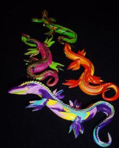 Handmade with Polymer Clay. Eyes are accentuated with seed beads. Bar pin on the back side. Each iguana comes in a jewelry box. Different and Intrigue!
