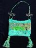 Hand-knitted with silk-wool. Decorated with a handmade Fimo Fish, glass beads and nickel wire. The fish is embellished with Austrian Crystals. Purse hanger is also handmade with nickel and glass beads. Unique design!