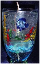 Large Gel Candle Close Up- Lt. Blue glass goblets. Gel wax and glass fish are used to embellish the gel candle. Dry flowers sticks are used to create the coral atmosphere. Zinc-cored wick for great and secure burning process. Unique designs!  All fragrances available! Specify the fragrance with your order. Thank you.