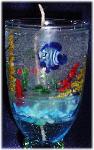 Large Size Gel Candle- Lt. Blue glass goblets. Gel wax and glass fish are used to embellish the gel candle. Dry flowers sticks are used to create the coral atmosphere. Zinc-cored wick for great and secure burning process. Unique designs!  All fragrances available! Specify the fragrance with your order. Thank you.