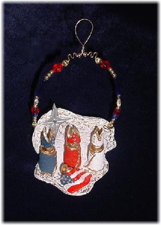 Patriotic Nativity Ornament-  This clay handmade nativity patriotic ornament is painted in matte white and gold enamel details. The three kings are painted in red, white and blue patriotic colors and baby Jesus is covered with the US flag blanket theme. Austrian crystals, glass beads and wire are used for final and hanging details. One-of-a-kind!