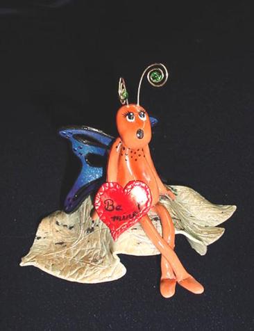 Handmade with FIMO. All details are hand crafted and finished with nickel silver wire. Unique Design!