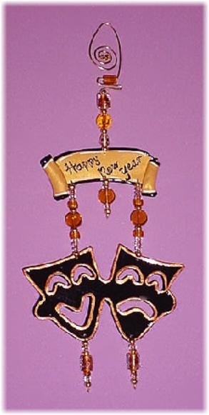 This porcelain handmade ornament is painted in glossy bright gold and black colors. Glass beads and wire are used for final details. Unique Design!