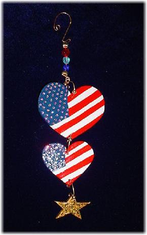 This porcelain handmade ornament is painted in glossy patriotic colors. Also some foil effects are applied. Austrian crystals, glass beads and wire are used for final and hanging details.