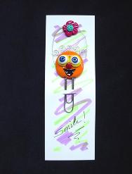 Individual Pimpollo Funny Face-Handmade with glazed Fimo. Silver wire, glass beads, tiny bells and large paper clips. Functional, colorful, funny and durable. Make everyone laugh with these funny 'Pimpollos' Faces! Some are also note holders.