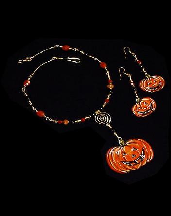 Pumpkin Necklace and Earrings Set- This porcelain handmade jewelry set is painted in glossy Halloween colors. Glass beads and gold plated findings are used for final details. Both items can be sold separately.Unique Design!