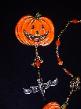 Halloween Pumpkin w/Bat Pin-This porcelain handmade pin is painted in glossy orange. Bat is painted in glossy black w/ gold Austrian Crystals for the eyes. Glass beads and wire are used for final details.Unique Design!