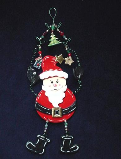 This porcelain handmade ornament is painted in pearly white, red and black bright colors. Gold enamel and foil effects are applied.  Each detail is set one by one. Green wire and glass beads are used for final details. Unique Design!