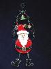  Christmas 'Hanging Santa' Ornament -This porcelain handmade ornament is painted in pearly white, red and black bright colors. Gold enamel and foil effects are applied.  Each detail is set one by one. Green wire and glass beads are used for final details. Unique Design!