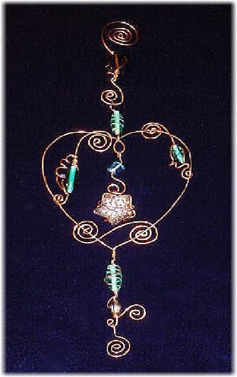This handmade ornament is hand crafted in Copper with blown glass beads. Each detail is created based on the artist's perspective and  creative freedom of expression.  Beautiful for garden, terrace or home accent decor. Unique Design!