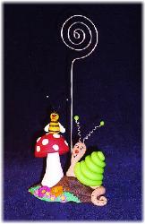 Handmade with glazed Fimo. Nickel and silver wire are used for final details.
