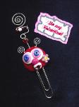 Valentine's Paper Clips-Handmade with glazed Fimo. Silver wire, glass beads and large paper clips. Functional, colorful, funny and durable. Make everyone laugh with these funny Valentine's Pimpollo Faces! Some are also note holders. 