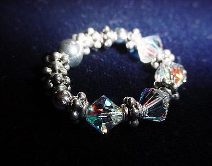 Handcrafted Swarovski Crystals Birth Silver Rings -  Handcrafted with Austrian Swarovski Crystals, Sterling Silver and Silver Plated findings and beads. Stretch cord is used to give flexibility.  Beautiful and Elegant to wear anytime.