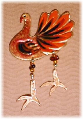 This porcelain handmade pin is hand painted in glossy bright colors. Glass beads and wire are used for the final details.   Unique Design!