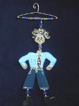 The Hanger People Father -This porcelain handmade ornament is painted in translucent colors. Also, black and white colors are used for final details. A unique design handmade hanger w/metal and glass beads are used to embellish the porcelain creation. Unique design, one-of-a-kind ! 100% handmade