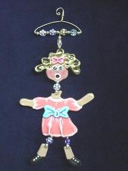 These porcelain handmade ornaments are painted in translucent light pink, bright pink, blue and other bright colors. Also, black and white colors are used for final details. A unique design handmade hanger w/metal and glass beads are used for final details. Unique design, one-of-a-kind ! 100% handmade