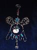 Seasonal Wire Angel Ornament-This handmade ornament is hand crafted in Copper with blown glass beads. Each detail is created based on the artist's perspective and  creative freedom of expression. Includes interchangeable seasonal accent in the center.  Beautiful for garden, terrace or home accent decor. Unique Design!