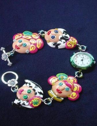Handmade with glazed Fimo. Silver plated  wire, findings and clasps are used for final details. The Titanium watch color tone complements the women faces bright colors. Very Unique one-of-a-kind design!