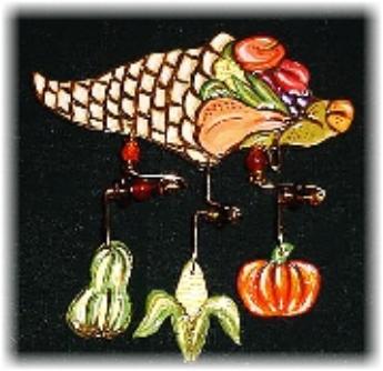 This porcelain handmade pin is hand painted in glossy bright colors. Glass beads and wire are used for the final details.   Unique Design!