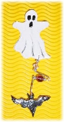 This porcelain handmade pin is painted in glossy pearly white. Bat is painted in glossy black w/ gold Austrian Crystals for the eyes. Glass beads and wire are used for final details. Unique Design!